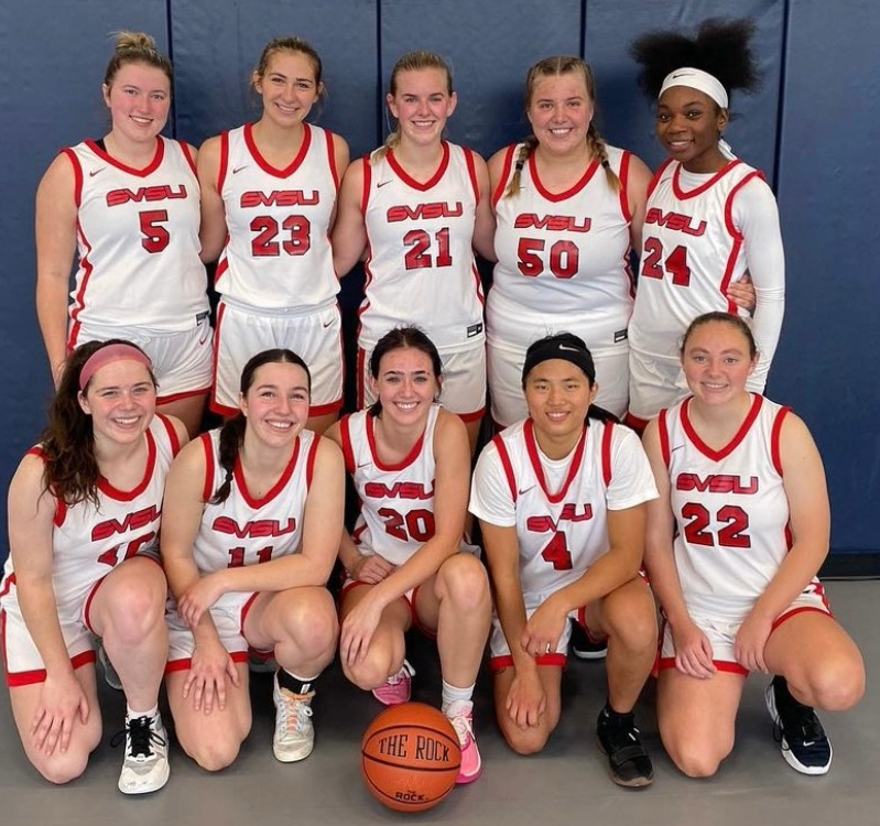 Girls cbb team photo next to stopper